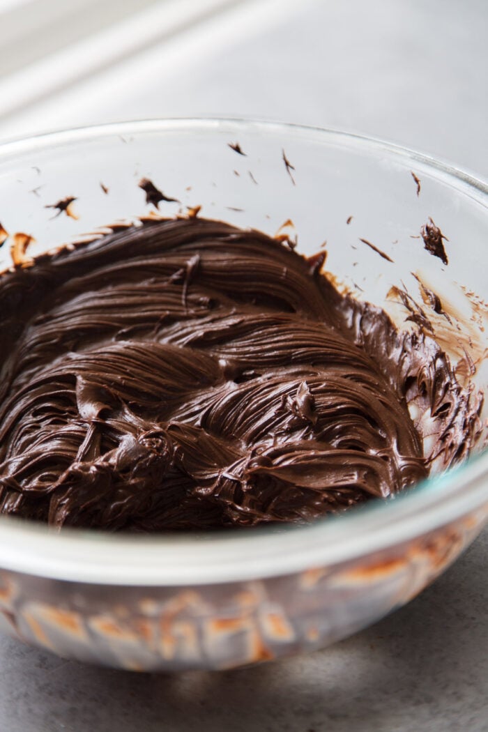 whipped ganache in clear bowl.