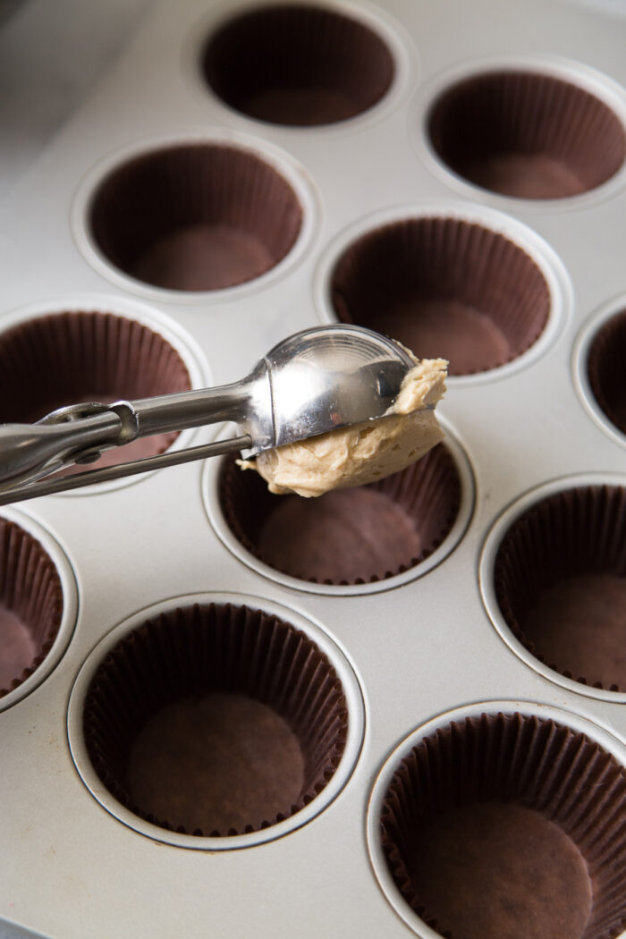 use a ice cream scoop to evenly portion out cupcake batter.