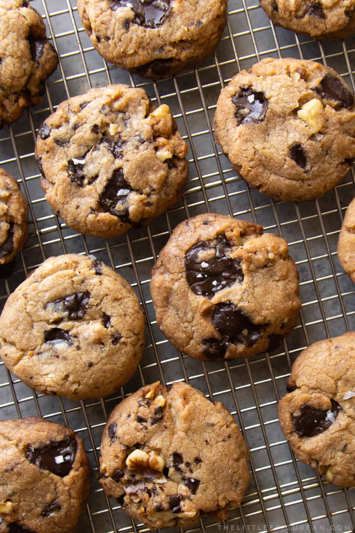 vegan chocolate chip walnut cookies on wire rack.