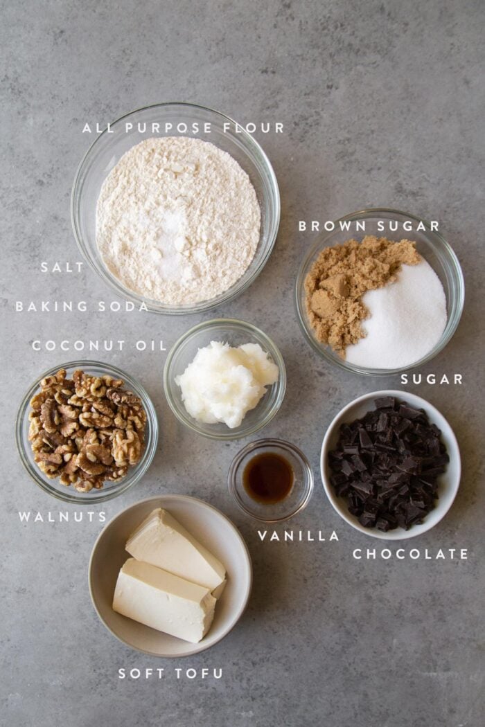 overhead shot of portion ingredients for vegan chocolate chip cookies instead soft tofu and coconut oil.