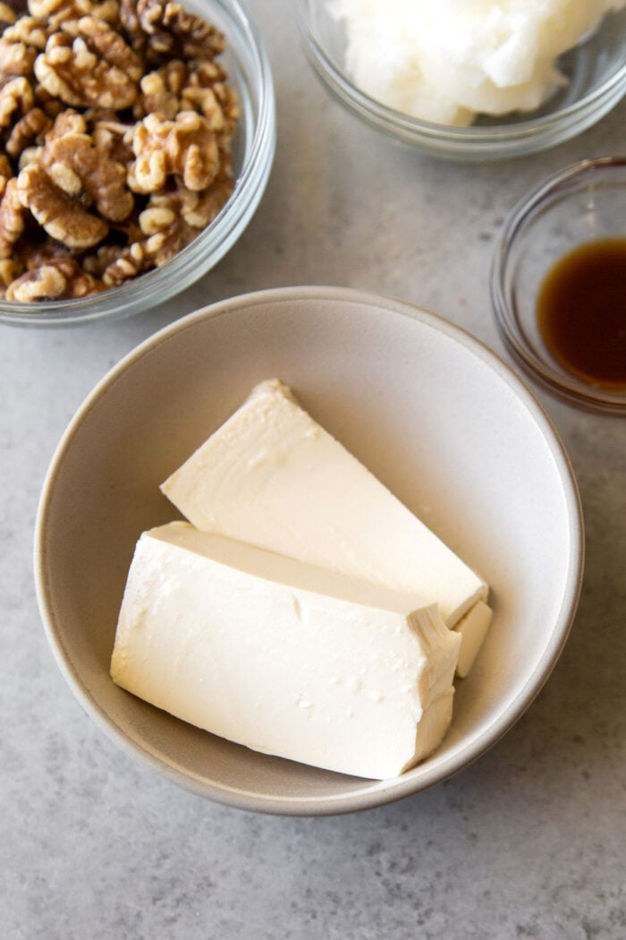 two slices of soft tofu in bowl.