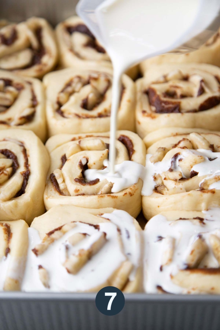 proofed cinnamon roll dough with cream before baking.