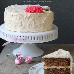 Carrot Nut Cake on white cake stand.