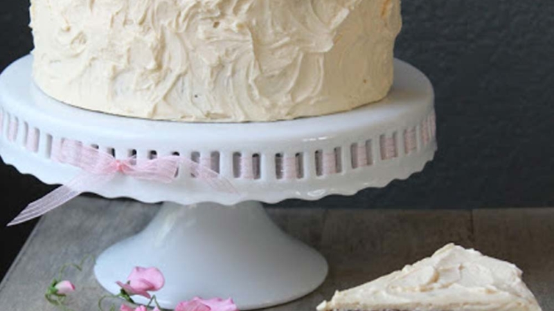 Carrot Nut Cake on white cake stand.