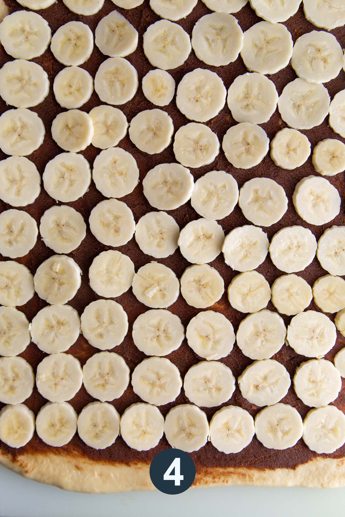 spread cinnamon sugar filling and top with banana slices. 