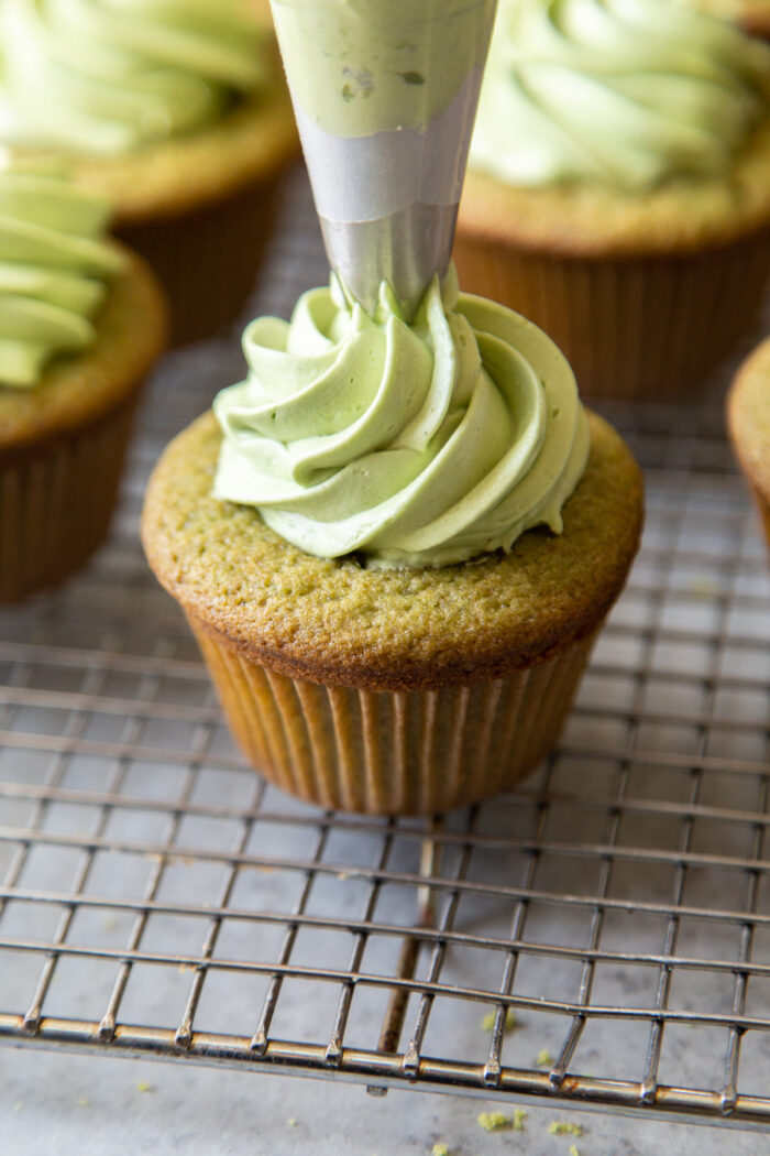 pipe enough matcha buttercream to hide sweet red bean filling.