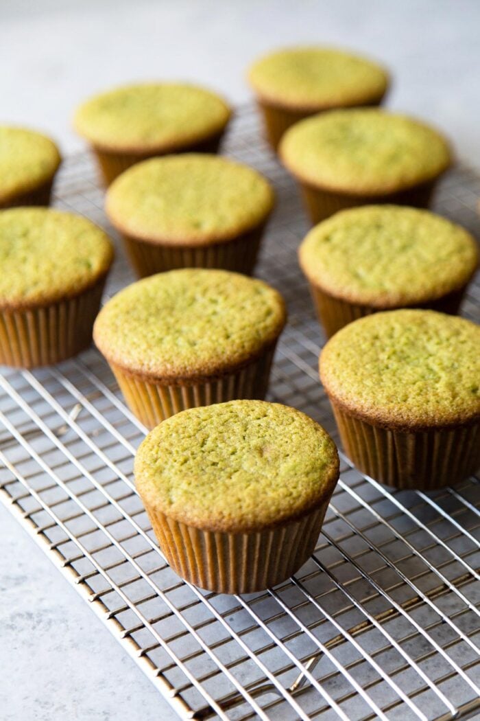 matcha cupcakes cooling on wire rack.