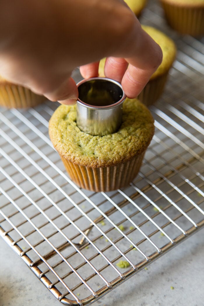 use a small round cookie cutter to punch out cavity in cooled matcha cupcake.