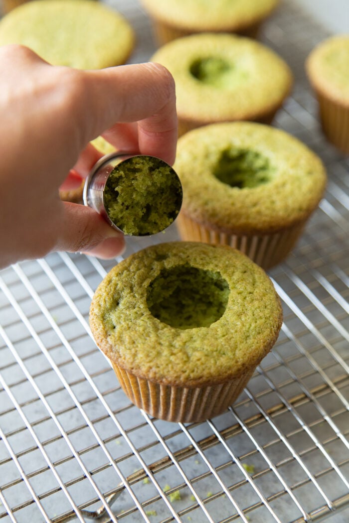 use a small round cookie cutter to punch out cavity in cooled matcha cupcake.