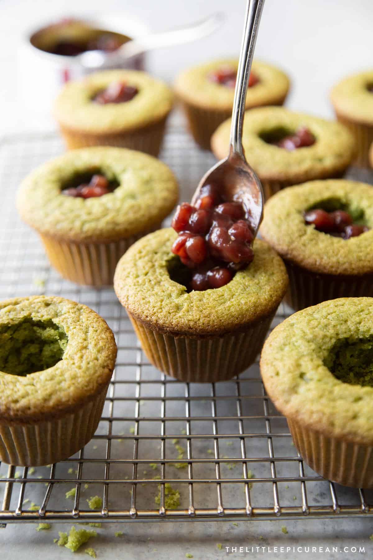 spoon in a small amount of sweetened red bean into each cupcake cavity.