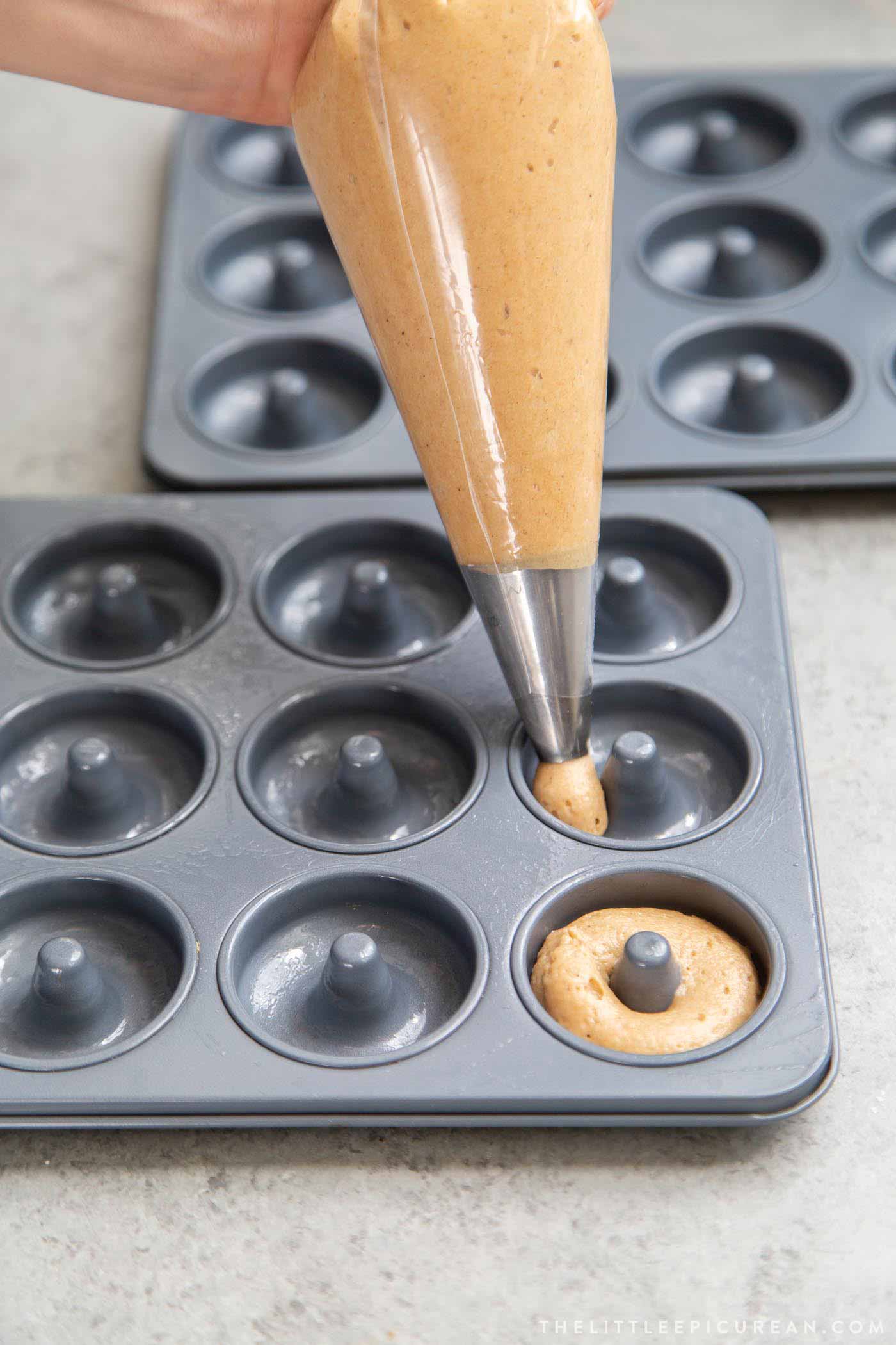 Piping baked mini donuts