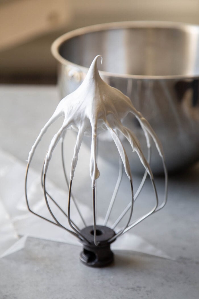 use whisk attachment to beat meringue to stiff peaks.