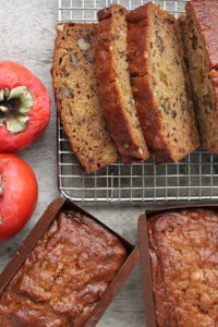 walnut persimmon cake cooling on rack.