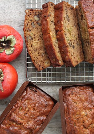 walnut persimmon cake cooling on rack.