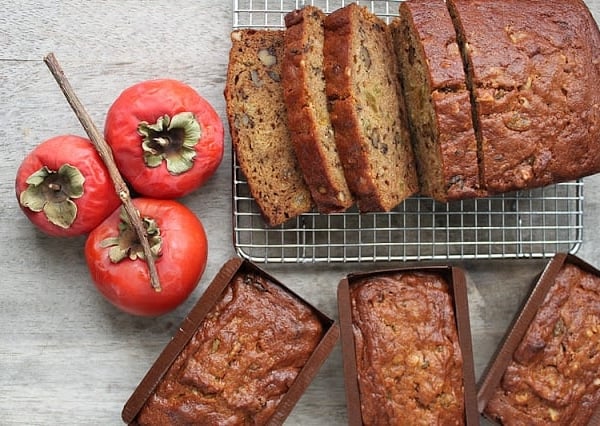 walnut persimmon cake cooling on rack.
