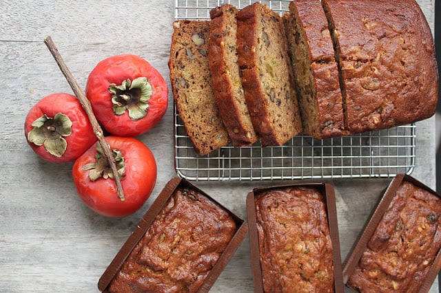 walnut persimmon cake cooling on rack.