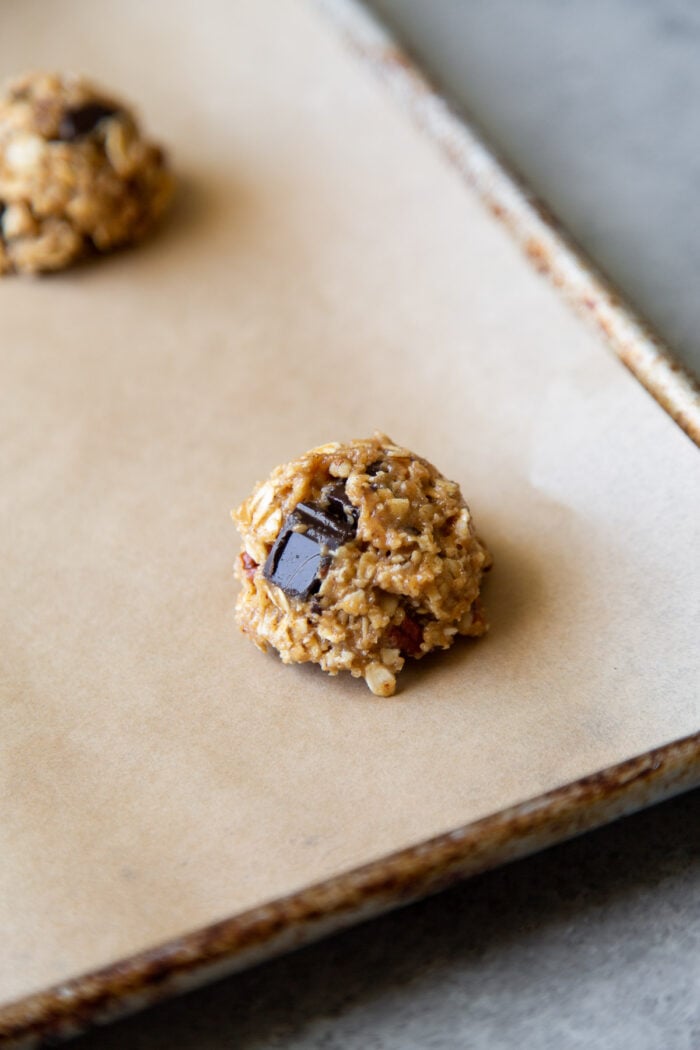 size 24 scoop of gluten-free oatmeal chocolate chip cookies before baking.