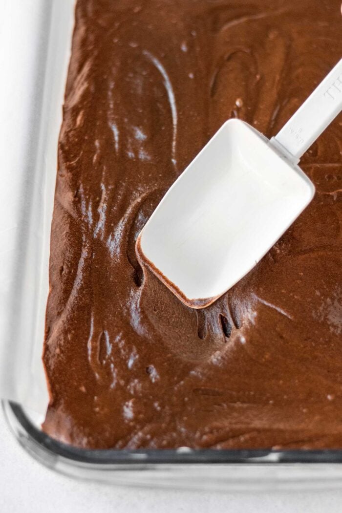 spread brownie batter in prepared baking pan