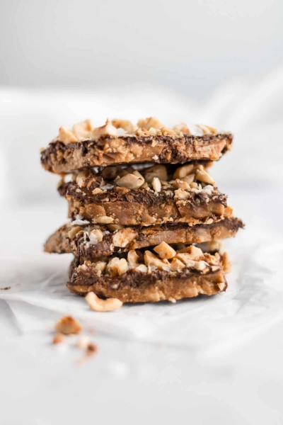 salted hazelnut toffee bark staked up tall.