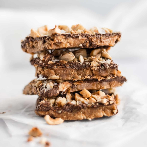 salted hazelnut toffee bark staked up tall.