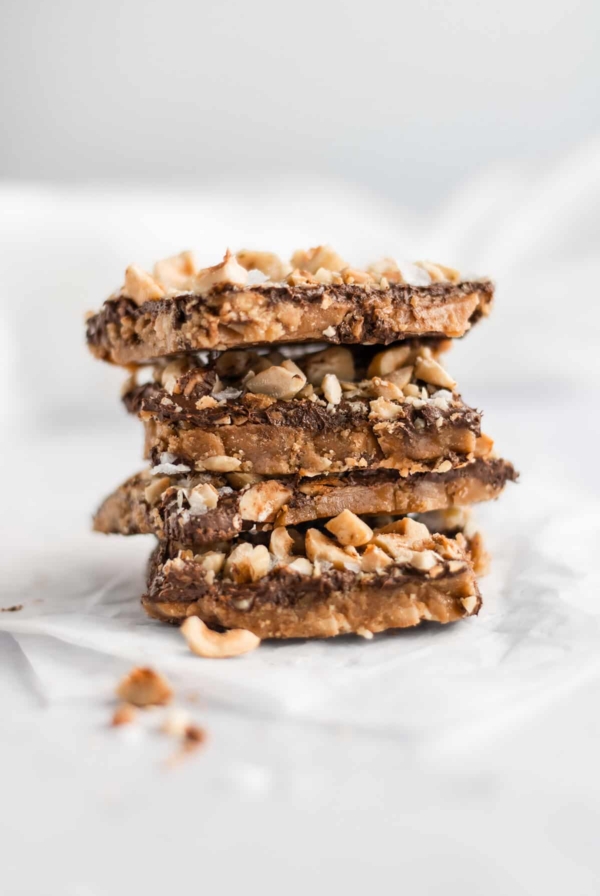 salted hazelnut toffee bark staked up tall.