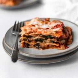a serving of spinach mushroom lasagna on plate
