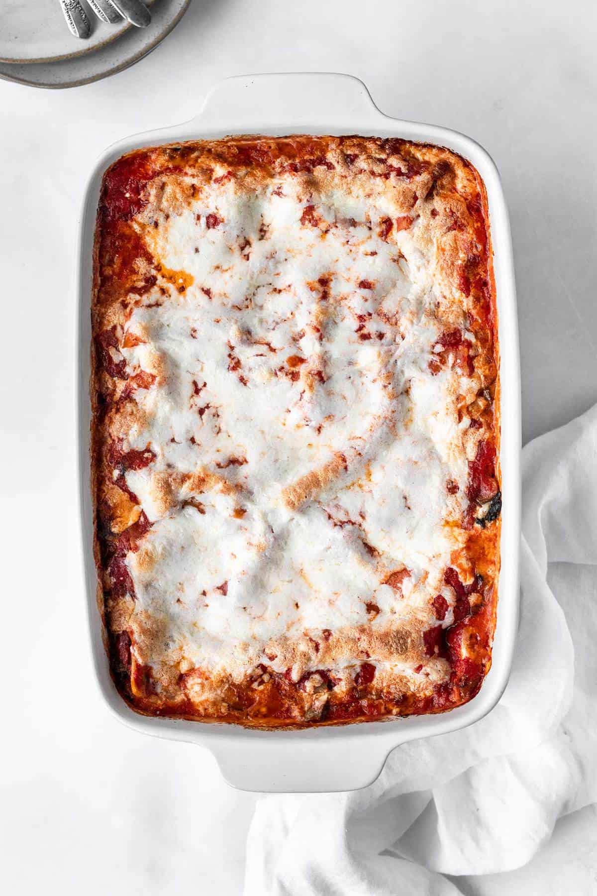 Overhead shot of baked spinach mushroom lasagna