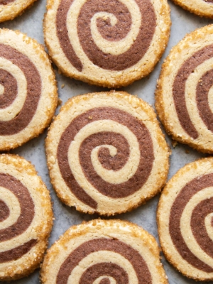 close up of peanut butter chocolate swirl cookies arranged in rows.