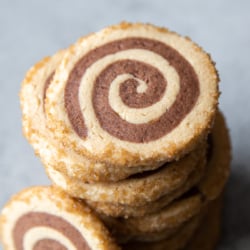 close up of stacked peanut butter chocolate pinwheel cookies.