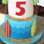 two tiered surf and sand birthday cake.