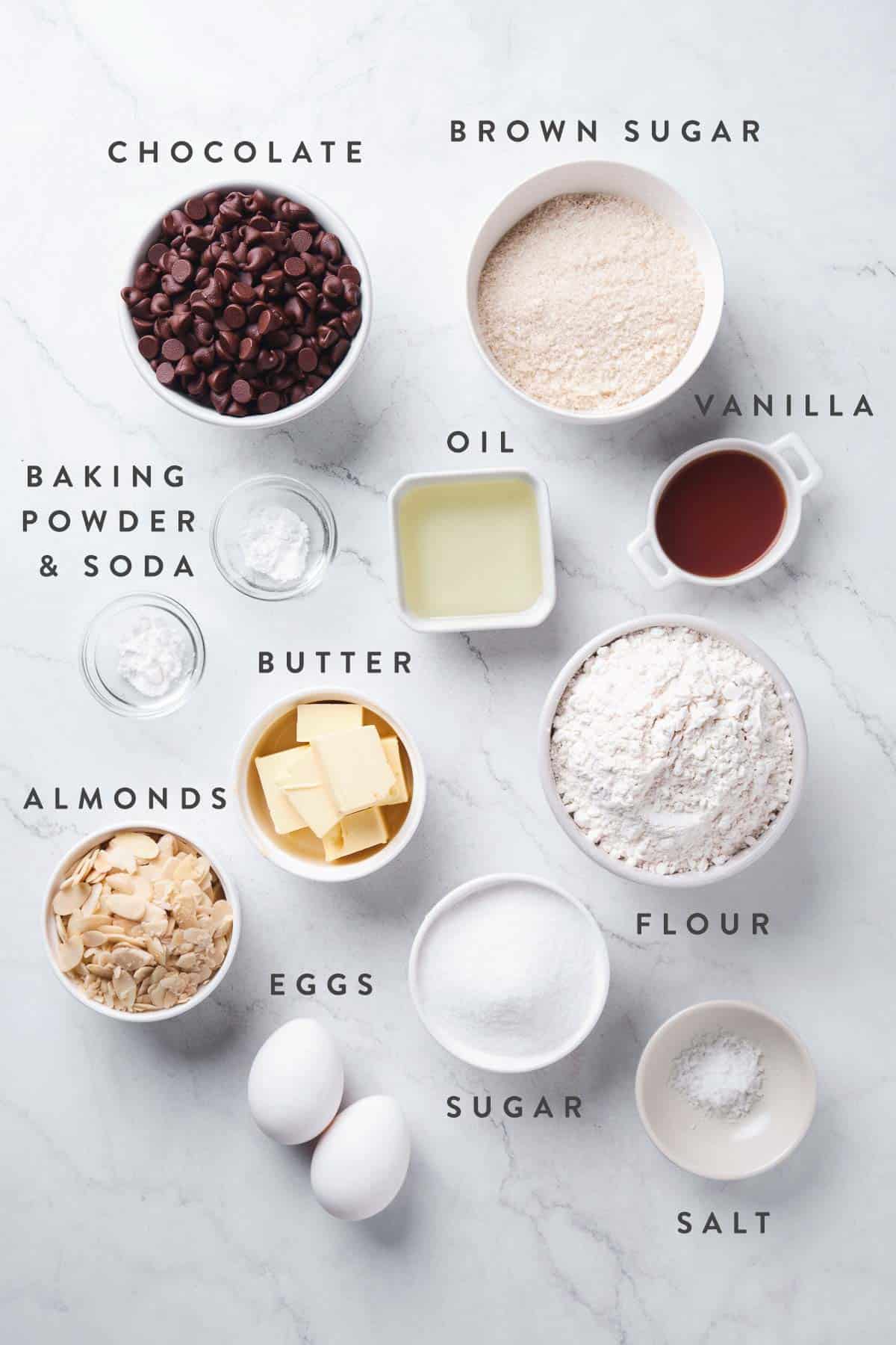 overhead shot of ingredients needed to make almond chocolate chip cookie bars.