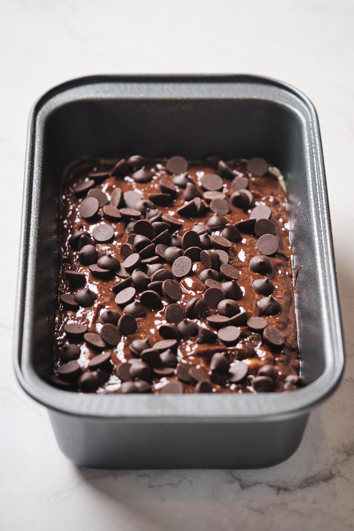 chocolate chip topped chocolate banana bread before baking.