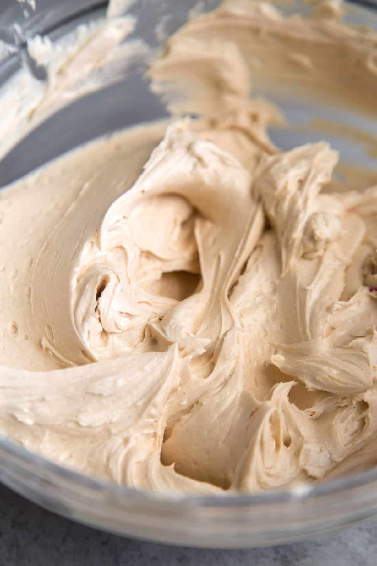 smooth peanut butter buttercream in glass bowl.