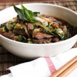 spicy basil beef in a white serving bowl.