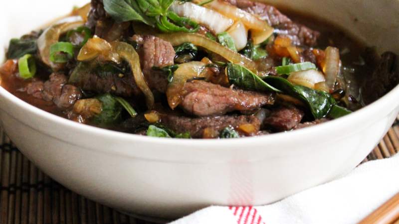 spicy basil beef in a white serving bowl.