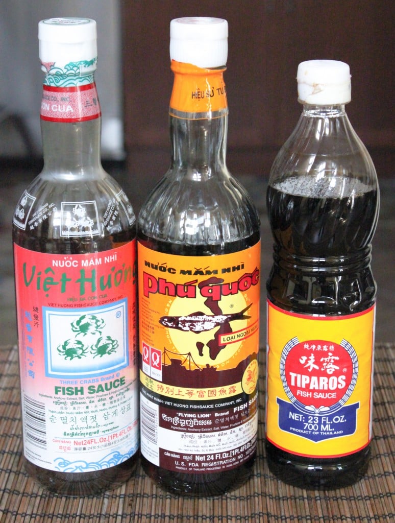 Three bottles of different fish sauces varieties. 