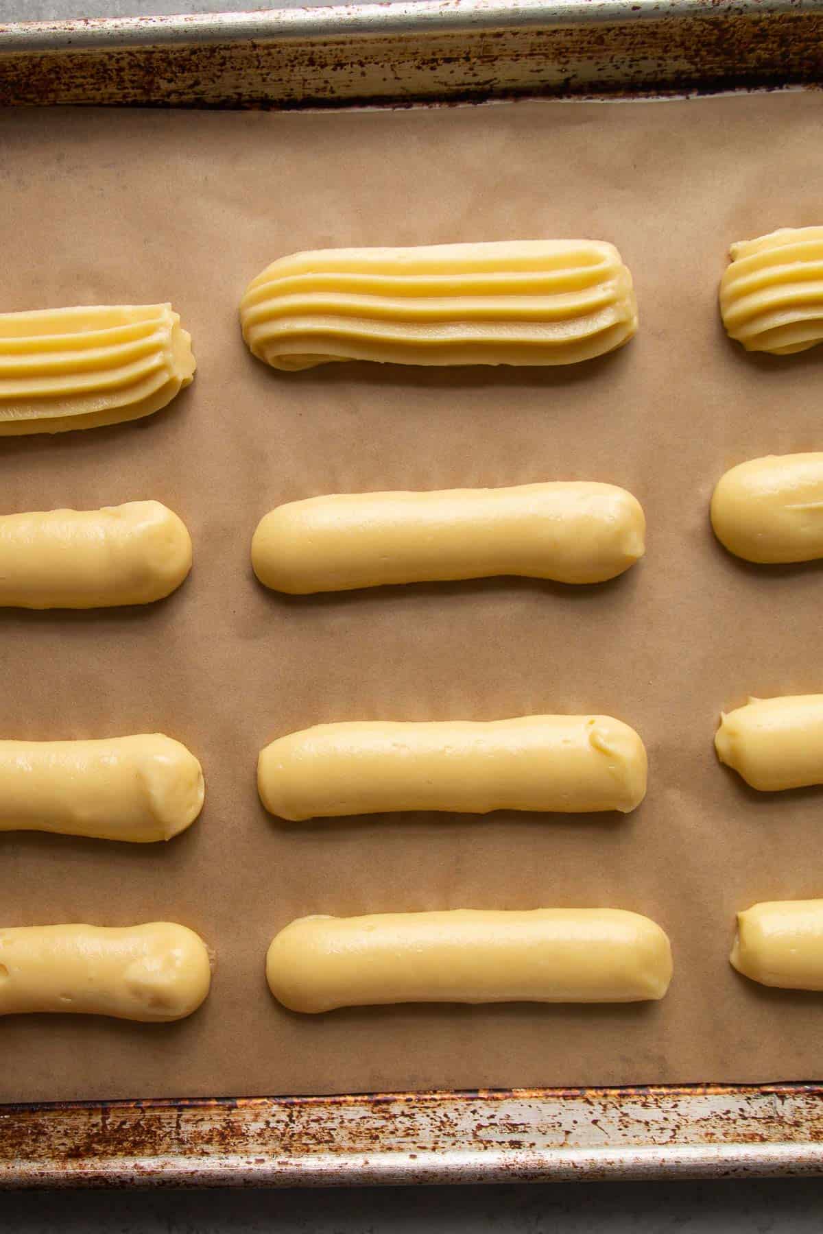 pipe choux pastry on prepared baking sheet.