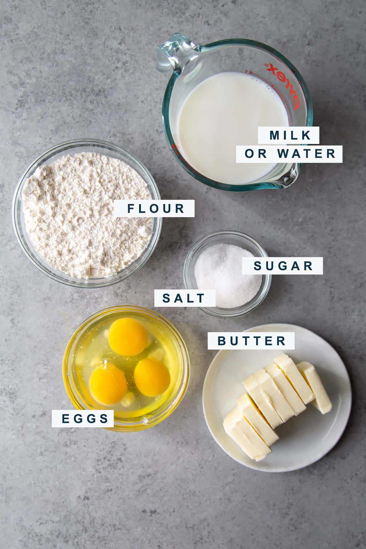 ingredients needed to make choux pastry for eclairs include butter, eggs, flour, and water or milk. 
