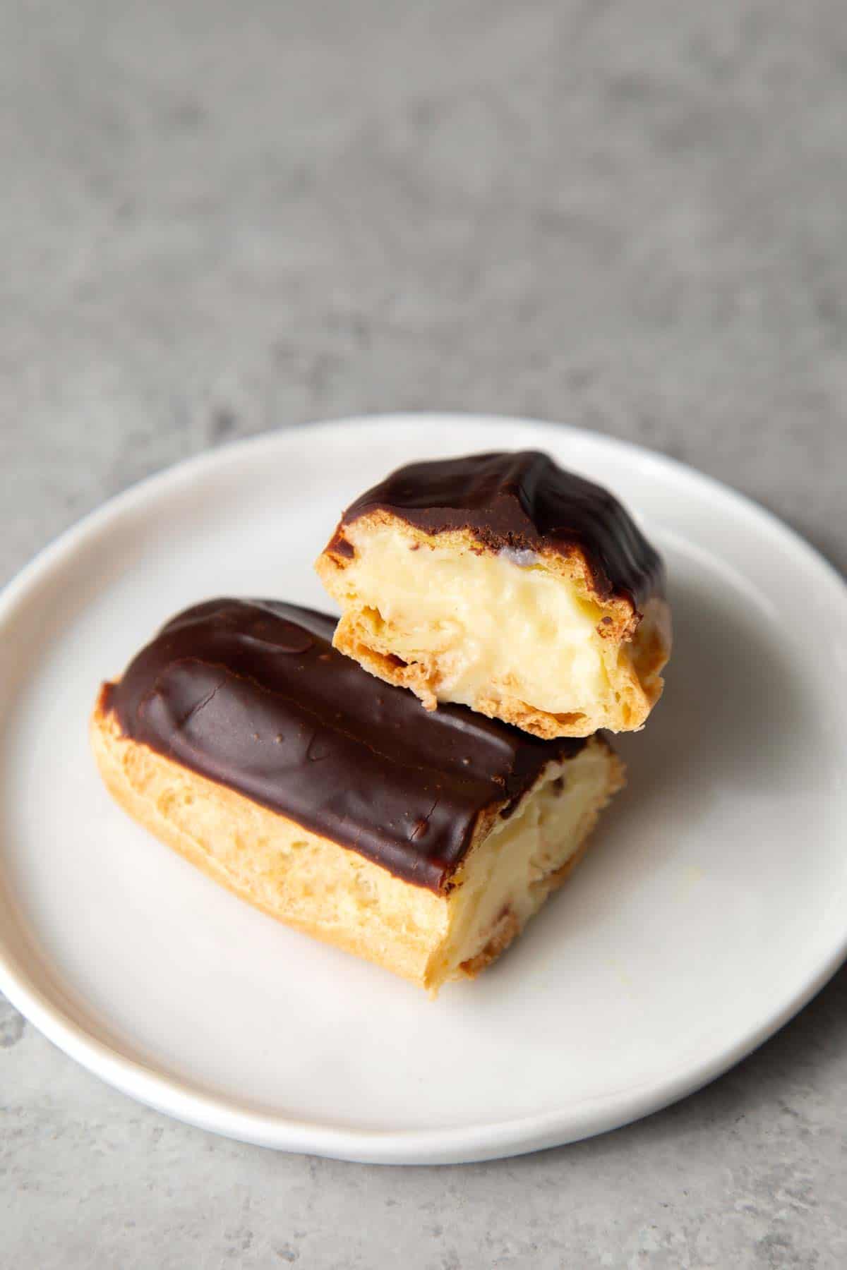 interior of pastry cream filled chocolate eclair.