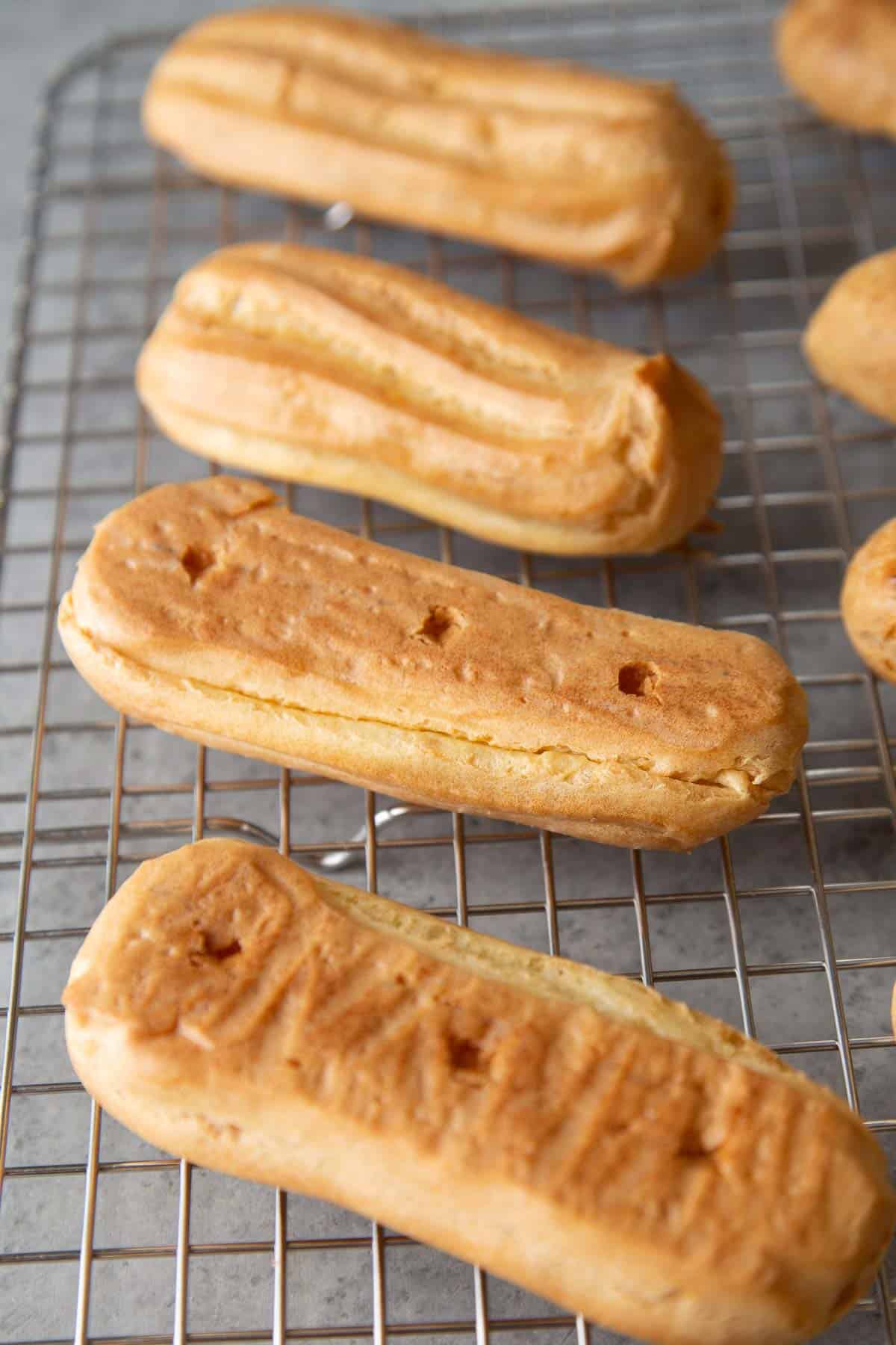 poke three holes on the bottom of eclair and fill with pastry cream.