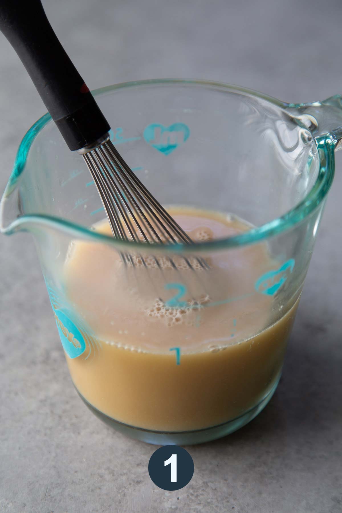 whisk together yeast, warm water, and barley malt syrup.