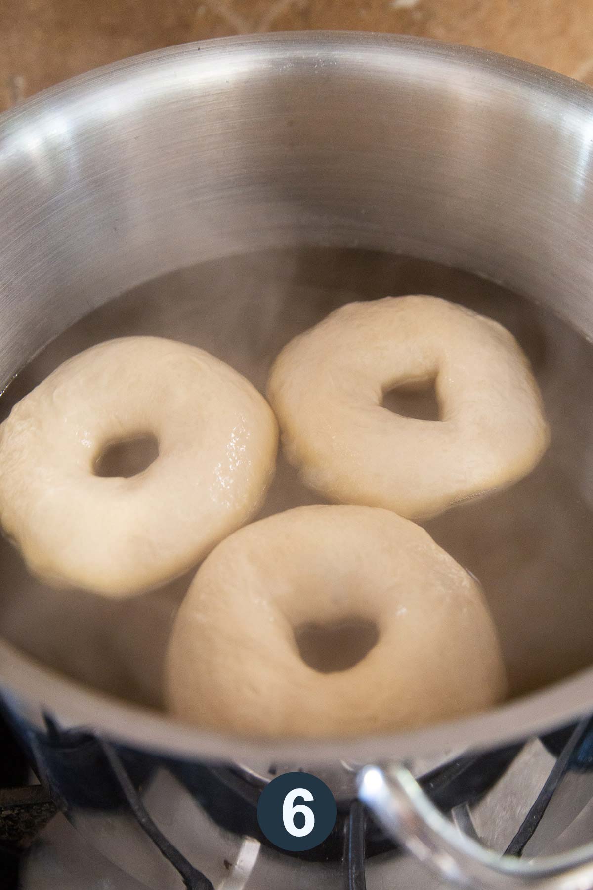 boil bagels in poaching liquid before baking.