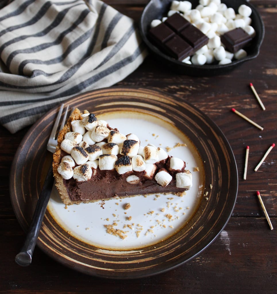 This s'mores pie is a sophisticated s'more that deems to be eaten with a fork. It includes the components of a traditional s'more updated into a modern pie!