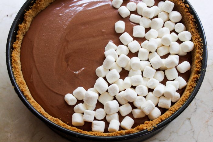 This s'mores pie is a sophisticated s'more that deems to be eaten with a fork. It includes the components of a traditional s'more updated into a modern pie!