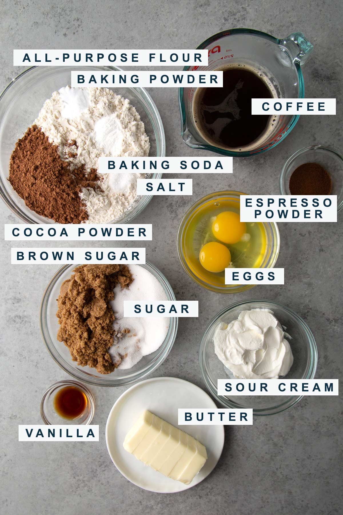 portioned ingredients needed to make mocha cupcakes include flour, cocoa powder, and coffee.