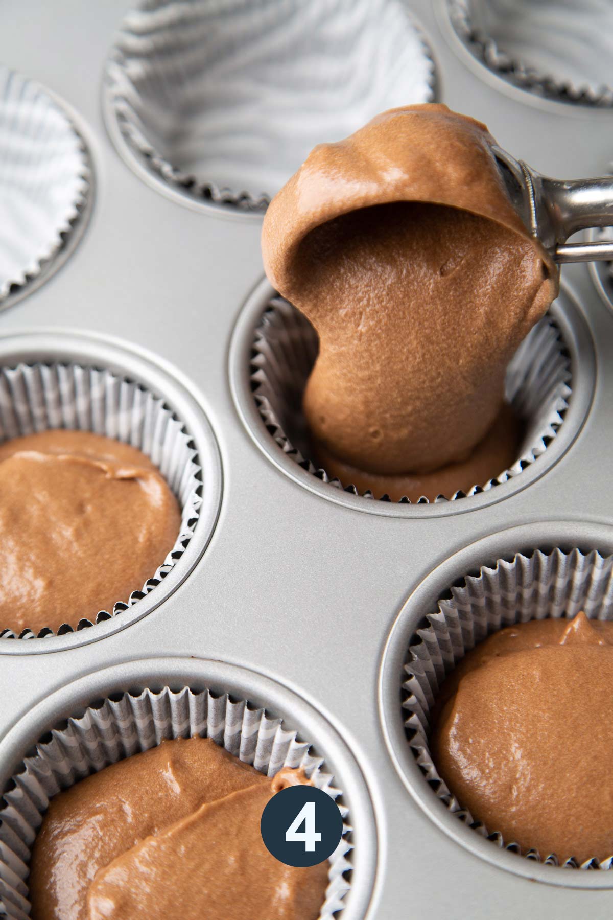 evenly portion out mocha cupcake batter among lined muffin tin.