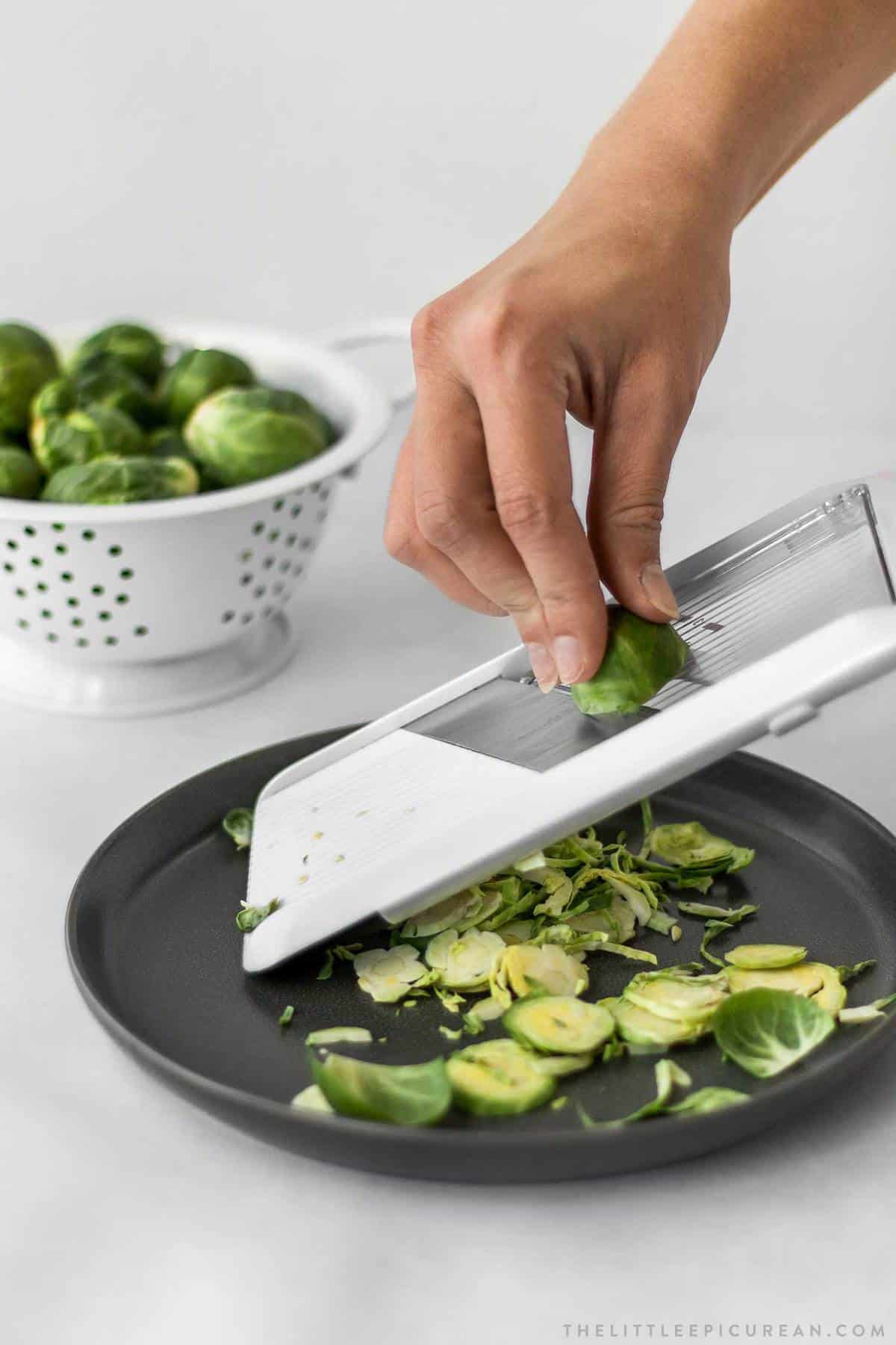 use a mandoline slicer to shave brussels sprouts