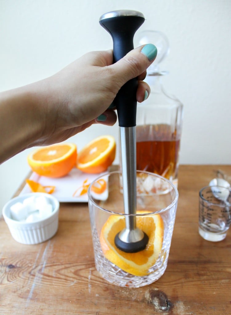 muddle the orange slice with sugar and bitters