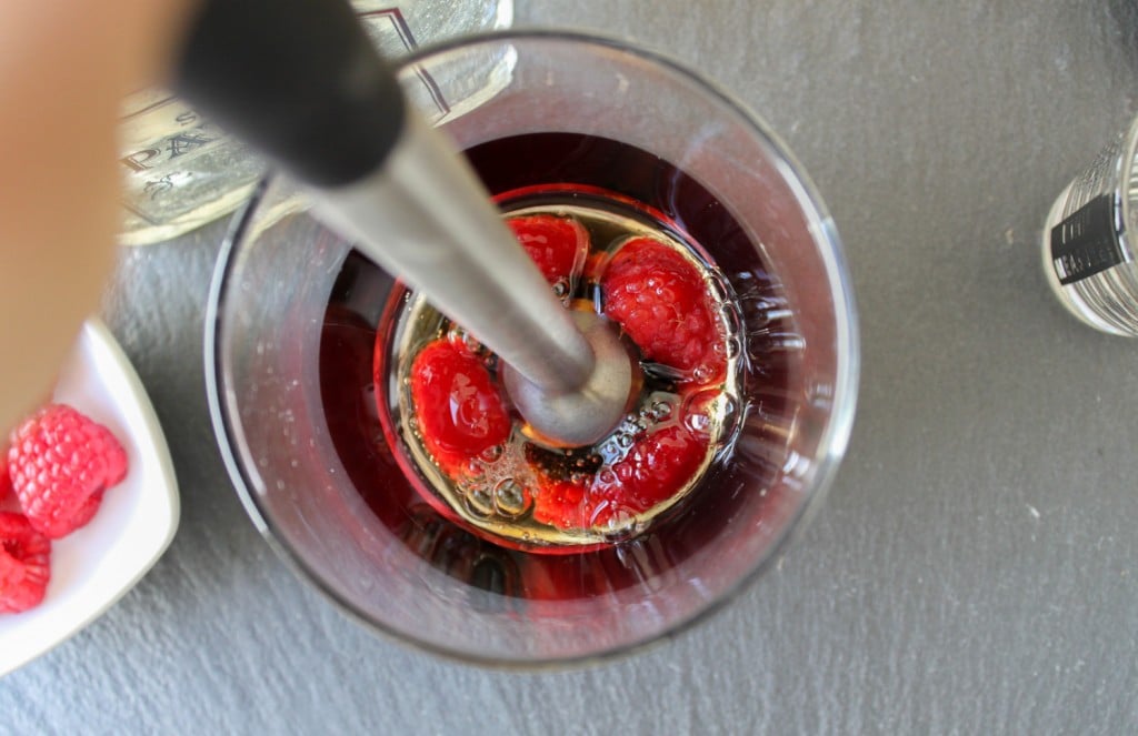 muddle together raspberries and agave syrup