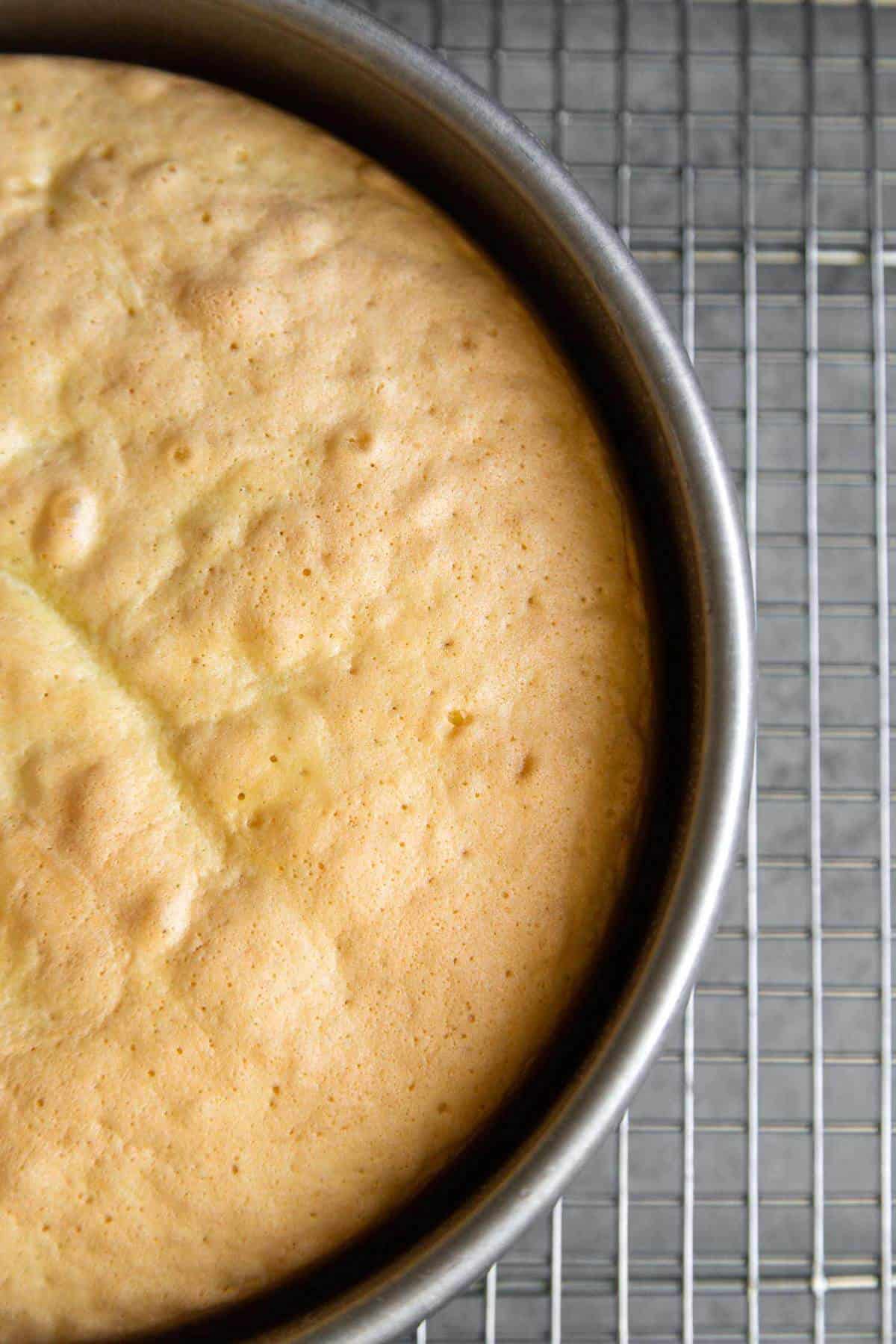 baked sponge cake will pull away from cake pan.